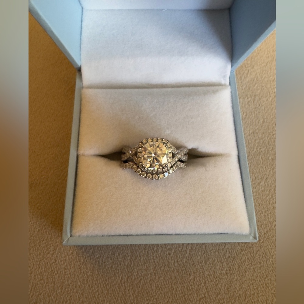 Moissanite 2ct cushion center stone w/halo and wedding band.